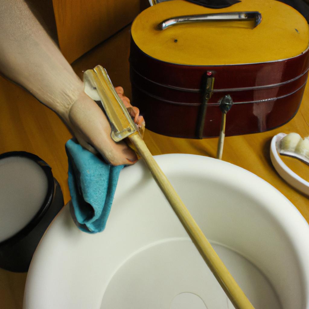 Person cleaning musical instrument supplies